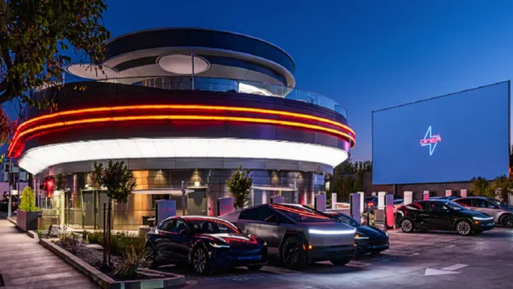 It's official - Tesla opens its first futuristic restaurant with drive-in movie theater, retro burgers and popcorn-serving robots