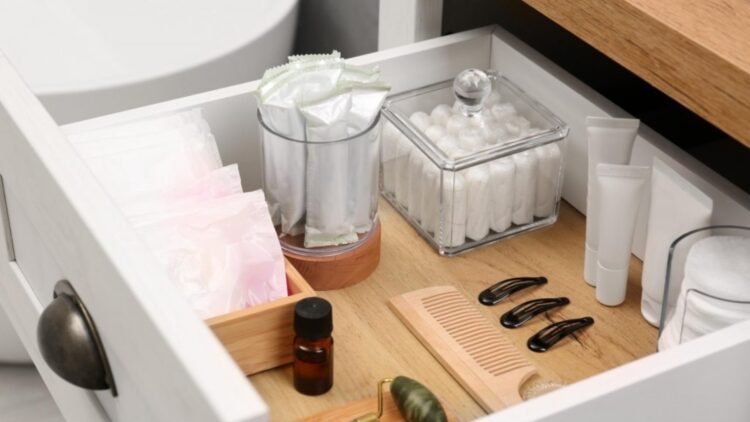 Say goodbye to bathroom clutter—this trick using candle holders and mirrors from Dollar Tree creates an elegant, inexpensive, three-tiered shelf that's perfect for keeping everything tidy