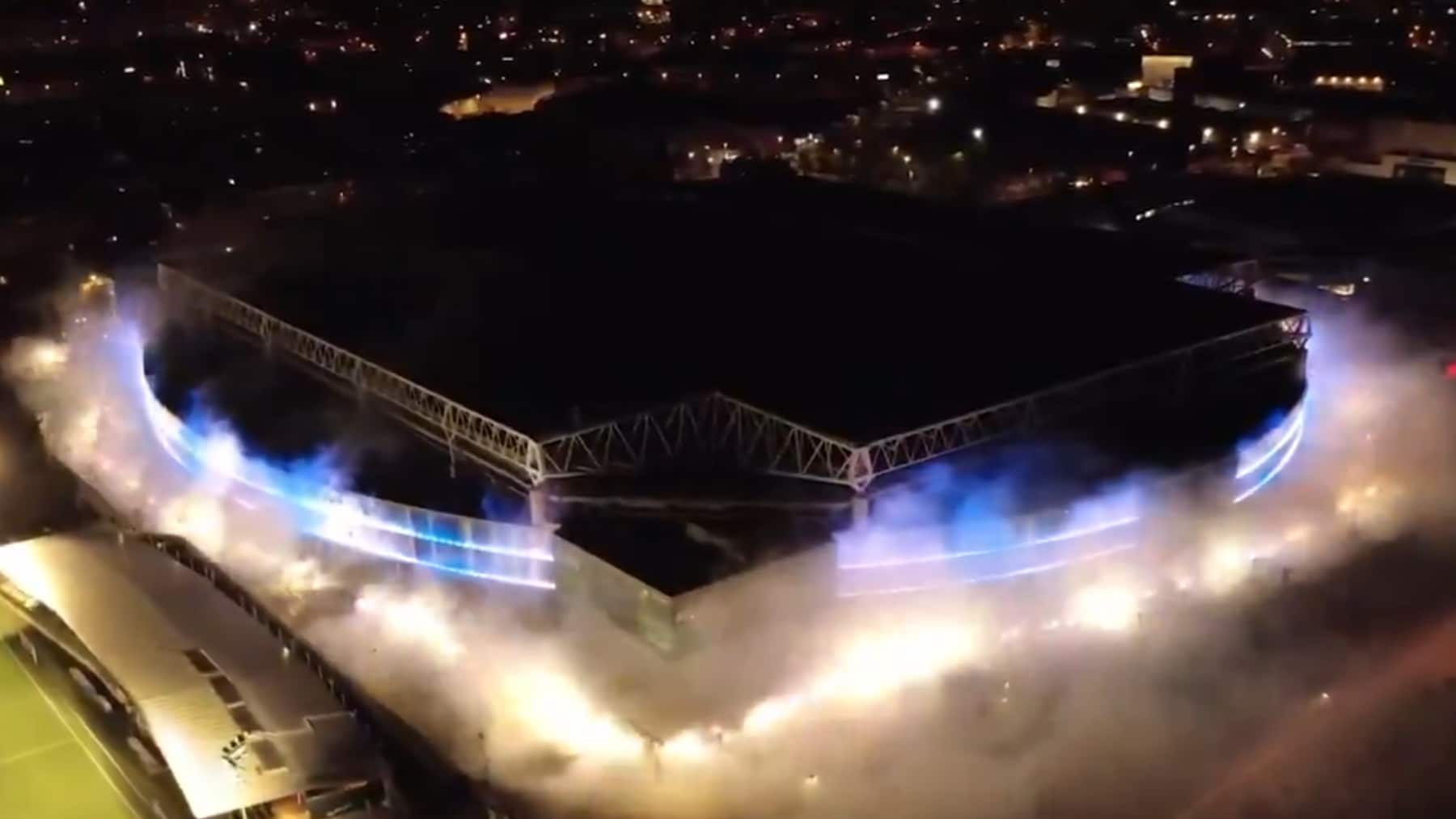 RCDE Stadium illuminated by flares for Espanyol 125th anniversary, showcasing fan passion.